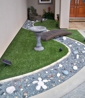 synthetic lawn turf with faux river and bridge