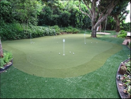 fake grass putting green with sand trap